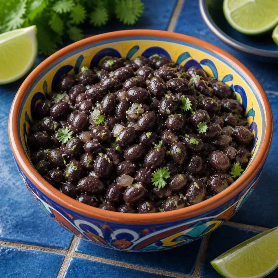 Cooked black beans in a colorful ceramic bowl