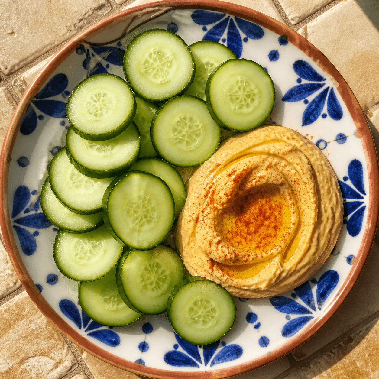 Cucumber slices served with hummus